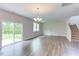 Bright and spacious living area with hardwood floors and sliding glass door at 37 Baird Cv Ln, Angier, NC 27501