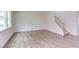 Living room with hardwood floors and access to staircase at 37 Baird Cv Ln, Angier, NC 27501