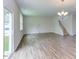 Spacious living room featuring hardwood floors and access to backyard at 37 Baird Cv Ln, Angier, NC 27501
