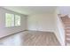 Living room with hardwood floors and access to staircase at 37 Baird Cv Ln, Angier, NC 27501