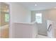 Upstairs hallway with carpet and access to bedrooms at 37 Baird Cv Ln, Angier, NC 27501