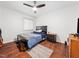 Bedroom featuring neutral walls, wood floors, and natural light at 4236 Lake Ridge Dr, Raleigh, NC 27604