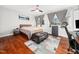 Main bedroom with hardwood floors, a bed, and plenty of natural light at 4236 Lake Ridge Dr, Raleigh, NC 27604