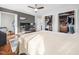 Well-lit primary bedroom featuring a large bed, wood floors, and ample closet space at 4236 Lake Ridge Dr, Raleigh, NC 27604