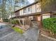 Inviting townhome showcasing a private gated front yard with tidy shrubbery and walkway at 4236 Lake Ridge Dr, Raleigh, NC 27604