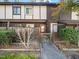 Charming townhome showcasing a gated entry with a private courtyard and well-maintained landscaping at 4236 Lake Ridge Dr, Raleigh, NC 27604