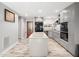 Contemporary kitchen with gray cabinets, granite counters, stainless steel appliances, and central island at 4236 Lake Ridge Dr, Raleigh, NC 27604