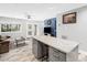 Open concept space featuring a granite kitchen island, living area, and French doors to the outside at 4236 Lake Ridge Dr, Raleigh, NC 27604