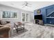 Cozy living room features neutral walls, a ceiling fan, and doors to the outside at 4236 Lake Ridge Dr, Raleigh, NC 27604