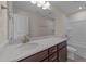 Bathroom showcasing vanity with solid surface counter, framed mirror and tub with shower at 48 Railcar Way # Homesite 2, Clayton, NC 27520