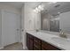 Double vanity bathroom with a large mirror and shower at 48 Railcar Way, Clayton, NC 27520