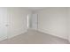 Well-lit bedroom with neutral walls and carpet at 48 Railcar Way, Clayton, NC 27520
