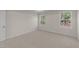 Charming bedroom with two windows and carpet at 48 Railcar Way, Clayton, NC 27520