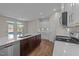 Bright kitchen with stainless steel appliances, marble counters, and an island at 48 Railcar Way, Clayton, NC 27520
