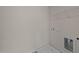 Laundry room with built-in shelving and a utility sink at 48 Railcar Way, Clayton, NC 27520