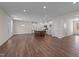 Spacious open concept featuring a modern kitchen with an island and stainless appliances at 48 Railcar Way, Clayton, NC 27520