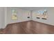 Bright living room with hardwood floors and plenty of natural light from large windows at 48 Railcar Way # Homesite 2, Clayton, NC 27520