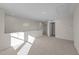 Bright loft area features neutral paint, plush carpeting, and a welcoming atmosphere for versatile living space at 48 Railcar Way # Homesite 2, Clayton, NC 27520