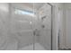 Glass enclosed shower with tile surround and a built-in niche at 48 Railcar Way # Homesite 2, Clayton, NC 27520