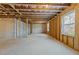 Unfinished basement with exposed ceiling, concrete walls and floor at 645 Silvercomet Dr, Knightdale, NC 27545