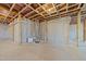 Unfinished basement with exposed ceiling, concrete walls and floor at 645 Silvercomet Dr, Knightdale, NC 27545