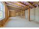 Spacious unfinished basement with concrete foundation and exposed ceiling at 645 Silvercomet Dr, Knightdale, NC 27545