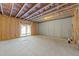 Unfinished basement with sliding glass doors to the exterior at 645 Silvercomet Dr, Knightdale, NC 27545