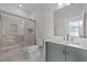 Bathroom featuring a glass shower, sink and toilet at 645 Silvercomet Dr, Knightdale, NC 27545
