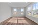 Bright bedroom with hardwood floors and large windows offering plenty of natural light at 645 Silvercomet Dr, Knightdale, NC 27545