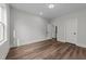 Bedroom featuring wood-look floors, interior doors, and recessed lighting at 645 Silvercomet Dr, Knightdale, NC 27545
