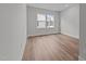 Bright bedroom with wood floors, large window and recessed lighting at 645 Silvercomet Dr, Knightdale, NC 27545