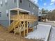 Two story home with a wooden back deck and covered patio area at 645 Silvercomet Dr, Knightdale, NC 27545
