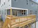 Close up of a back deck of a two story home with sliding glass door access at 645 Silvercomet Dr, Knightdale, NC 27545