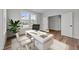 Bright home office features large window, hardwood floors, desk, and modern decor at 645 Silvercomet Dr, Knightdale, NC 27545