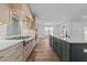 Well-equipped kitchen featuring a large island, stainless appliances, and custom cabinetry at 645 Silvercomet Dr, Knightdale, NC 27545