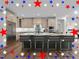 Beautiful kitchen with light cabinets, stainless steel appliances, and spacious island with seating at 645 Silvercomet Dr, Knightdale, NC 27545