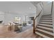 Bright, open living room with hardwood floors, contemporary furnishings, and natural light from sliding glass door at 645 Silvercomet Dr, Knightdale, NC 27545