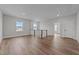 Second floor loft with hardwood floors, neutral colors, and abundant natural light at 645 Silvercomet Dr, Knightdale, NC 27545