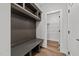 Mudroom with custom built-in bench and storage, leading to a walk-in pantry at 645 Silvercomet Dr, Knightdale, NC 27545