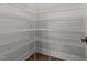 Walk-in pantry with shelving units for organized storage and convenience at 645 Silvercomet Dr, Knightdale, NC 27545