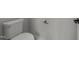 Close-up of a toilet with silver handle and nearby paper towel rack at 645 Silvercomet Dr, Knightdale, NC 27545
