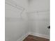 Walk-in closet with wood floor and wire shelving at 645 Silvercomet Dr, Knightdale, NC 27545
