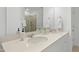 Elegant bathroom with double vanity and a walk-in shower at 747 Creekway Dr, Fuquay Varina, NC 27526