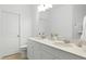 Modern bathroom with double vanity and a large mirror at 747 Creekway Dr, Fuquay Varina, NC 27526