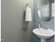 Small bathroom with pedestal sink and oval mirror at 747 Creekway Dr, Fuquay Varina, NC 27526