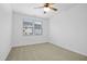 Bright bedroom with carpet flooring and double windows at 747 Creekway Dr, Fuquay Varina, NC 27526
