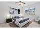 Virtually staged bedroom with ceiling fan and neutral decor at 747 Creekway Dr, Fuquay Varina, NC 27526
