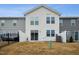 Townhouse rear view, showing a private fenced yard at 747 Creekway Dr, Fuquay Varina, NC 27526