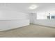 Bright hallway with carpeted floor and neutral walls at 747 Creekway Dr, Fuquay Varina, NC 27526