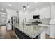 Modern kitchen featuring granite countertops and stainless steel appliances at 747 Creekway Dr, Fuquay Varina, NC 27526
